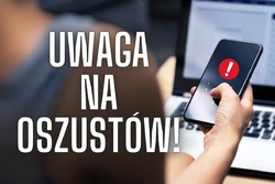 napis uwaga na oszustów